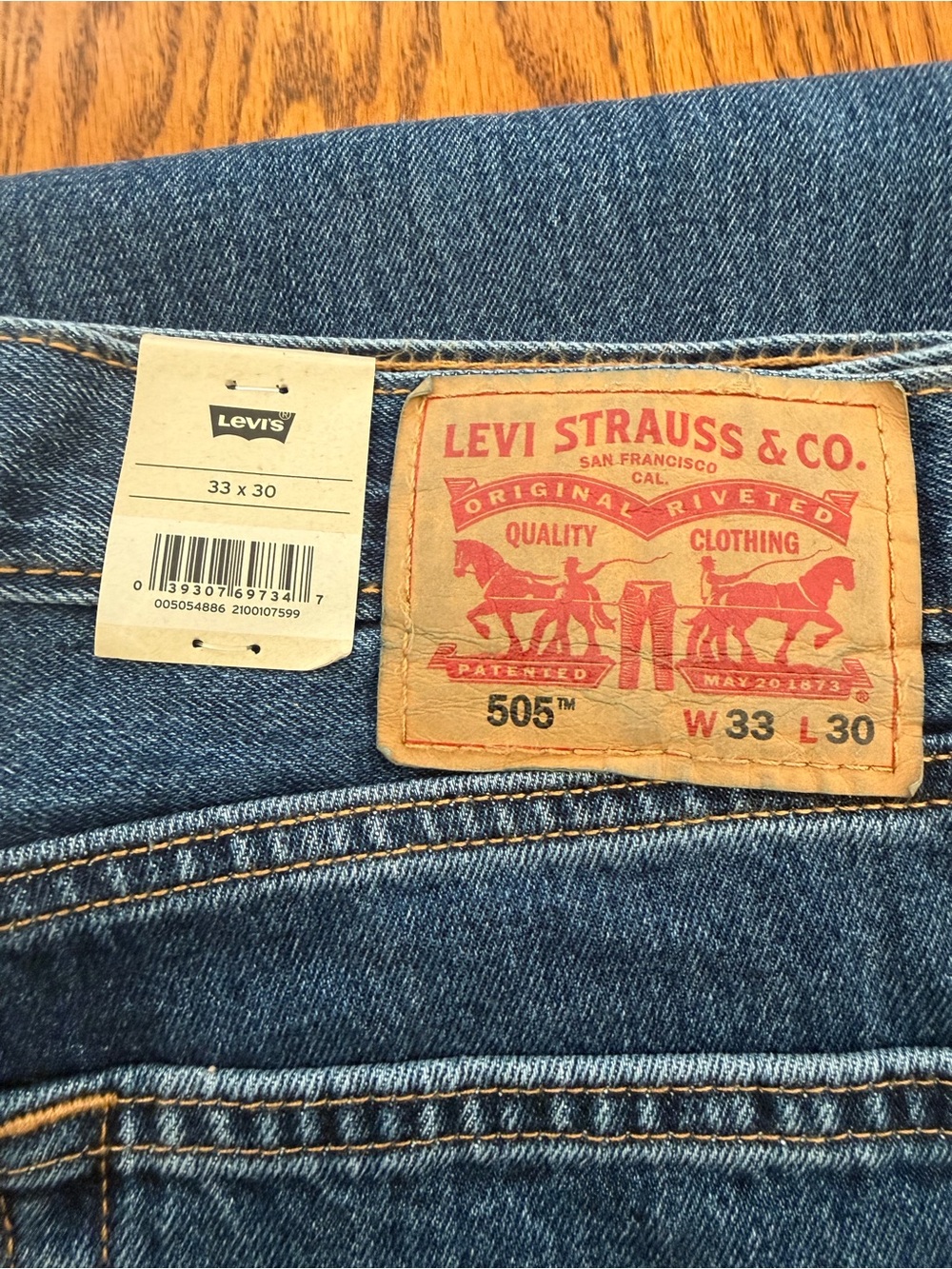 Levi's Men's Bootcut Jeans in Blue Denim with Tan Patch